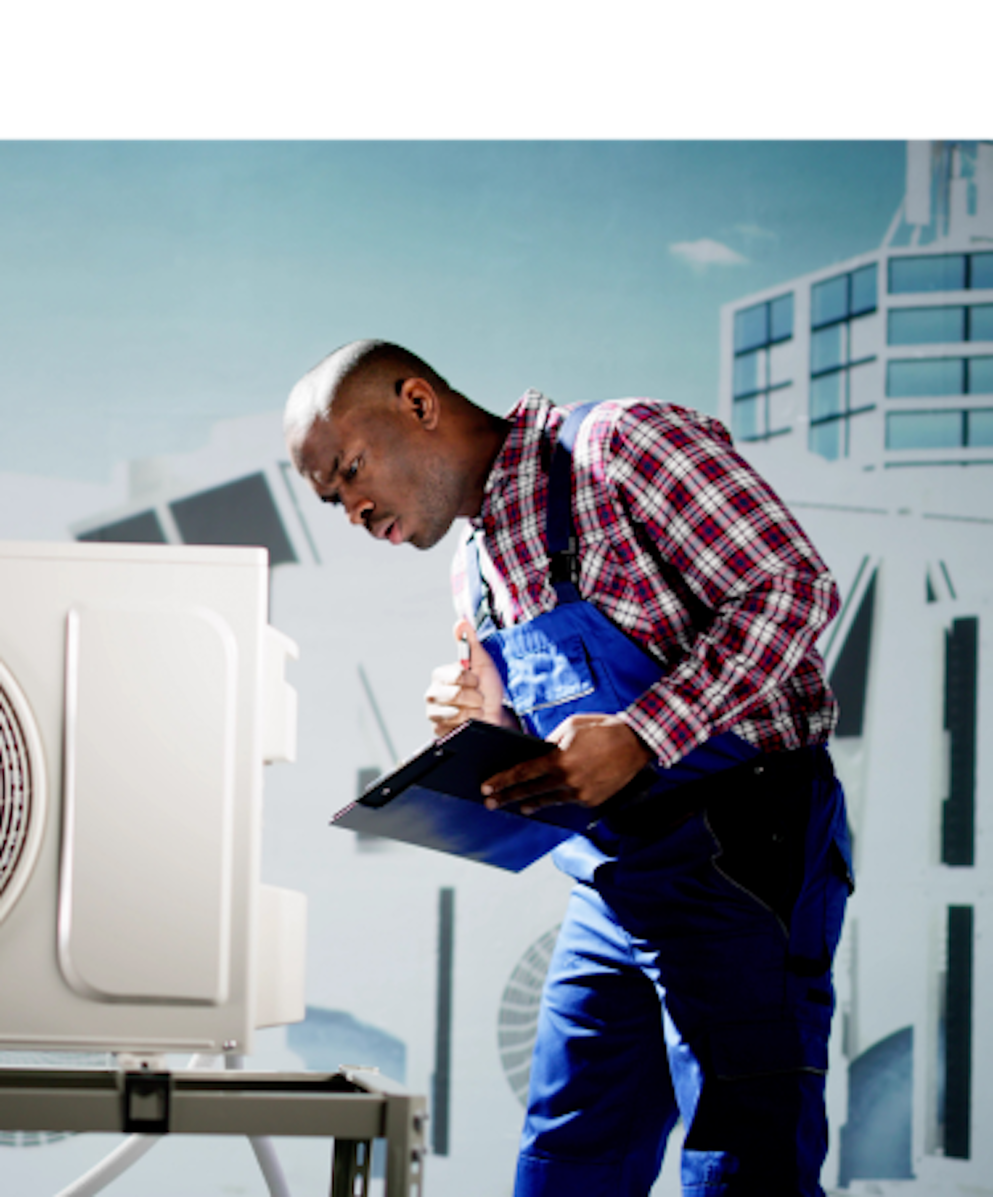 An individual in a plaid shirt holding a clipboard stands next to an outdoor air conditioning unit on a rooftop, with buildings in the background